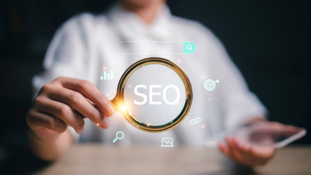 Woman holding through magnifying glass with text SEO, the concept for promoting ranking traffic on the website, optimizing your website to rank in search engines. SEO Search Engine Optimization,の写真素材