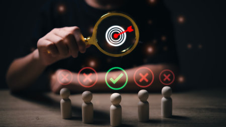 HRM or Human Resource Management, Magnifier glass focus to manager business icon which is among staff icons for human development recruitment leadership and customer target group concept.の写真素材