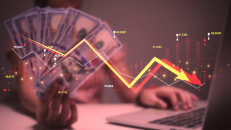 Economic crisis, Women analyzing sales data and economic graph chart that is falling due. the stock...