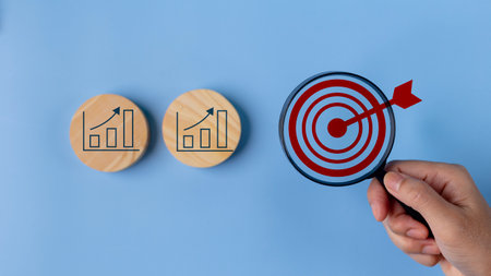 Goal and graph icons on wooden blocks, Business growth success process, Business achievement goal and target, Planning and development for the corporation.の写真素材
