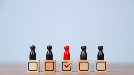 Business Leadership concept, Business hiring, and recruitment selection, Human resource. A wooden person figures the crowd with a red check mark for the choice of leadership.の写真素材