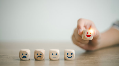 Client satisfaction feedback review. World Mental Health Day. Customers pick wooden labels with smiley happy and relaxed faces. Good score rating, Think positiveâmental state health.の写真素材