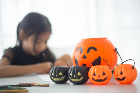 Happy Asian child girl in a witch costume to Halloween. trick or treat. Kids trick or treating.の写真素材