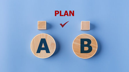 Checking the PLAN A or B on wooden blocks with the words Plan A and B on a blue background.の写真素材