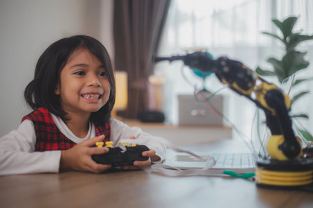 STEM education concept. Asian students learn at home by coding robot arms in STEM, mathematics...