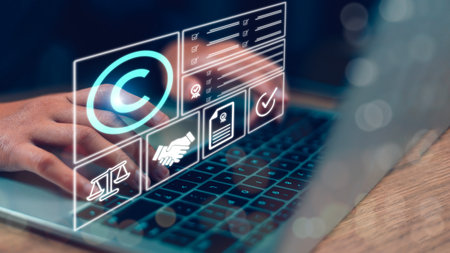 Copyright or patent concept, Person's hand using a laptop computer on a futuristic virtual interface...