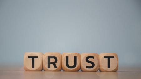 Wooden blocks with the word trust. Building trust in business concept.
