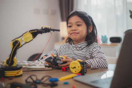 Asian students enjoy Machine Learning Robot arms Control robots in technology class, stem education...