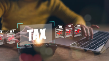 TAX REFUND and refund tax of duty taxation business, graphs and chart being demonstrated on the screen media, tablet pc and selecting tax refund.の写真素材