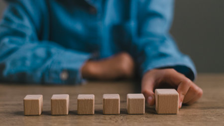 Blank wooden cubes on the table with copy space, empty wooden cubes for input wording, and an...