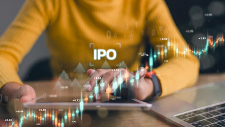 IPO, Initial public offering concept. Businesswomen use a tablet with virtual IPO words with stock graphs to boost the growth of the IPO process.の写真素材