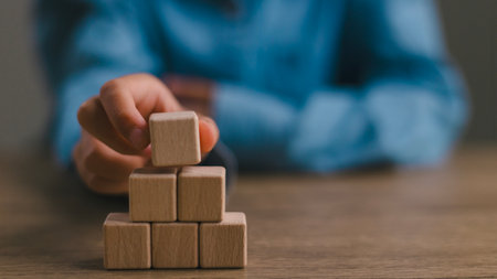 Blank wooden cubes on the table with copy space, empty wooden cubes for input wording, and an...