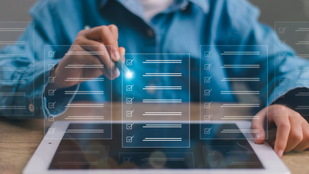 Checklist concept. Businessman using tablet. Checking marks on checkboxes on the futuristic virtual...
