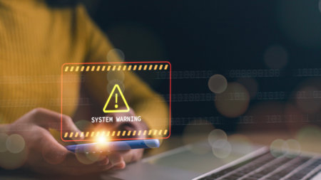 System warning caution sign on smartphone, scam virus attack on firewall for notification error and...
