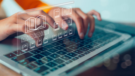 A person is typing on a laptop with a book icon on the screen. Concept of reading and learning, as...