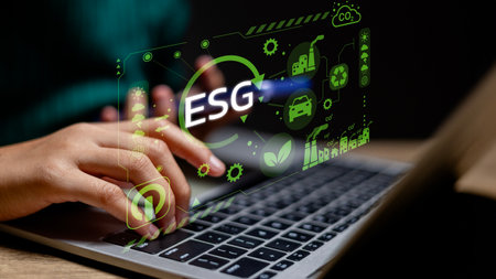 A person is pointing to the word ESG on it. Concept of sustainability and environmental...