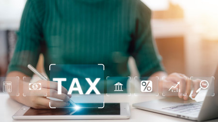 Women use computers to fill out personal income tax returns to pay taxes online. State tax. Financial research. data analysis, documents, reports, tax returns, and calculations. Tax concept.の写真素材