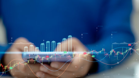 Businessman working on smartphones analyzing finance sales data and economic growth graph charts and...