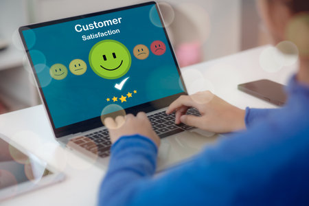 The businessman pressed a smiley face emoticon on the virtual touch screen, a customer service evaluation concept.の写真素材