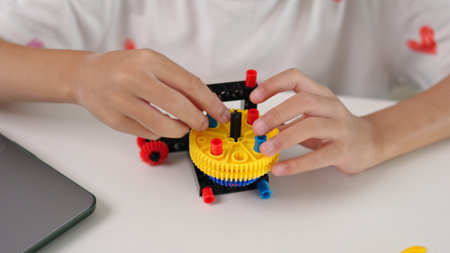 STEM education concept. Asian home school girls self-study online lessons and are excited to make STEM toys. mathematics engineering science technology computer code in robotics for kids' concepts.の写真素材