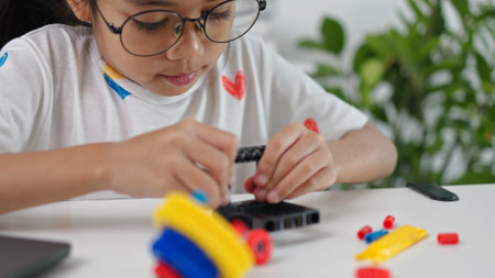 STEM education concept. Asian home school girls self-study online lessons and are excited to make STEM toys. mathematics engineering science technology computer code in robotics for kids' concepts.の写真素材