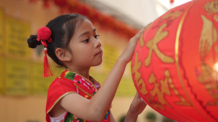young Chinese girl with traditional dressing up celebrate Chinese new yearの写真素材