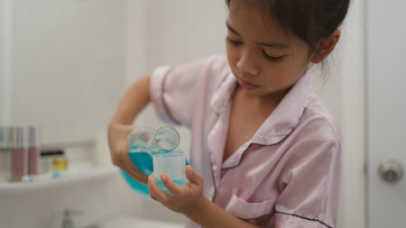 Asian cute girl to rinse your mouth after brushing your teeth, health care conceptの写真素材