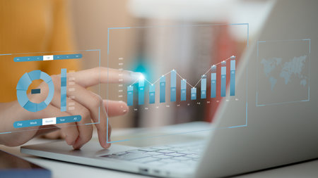 Analyst working with computer in Business Analytics and Data Management System with KPI and metrics...