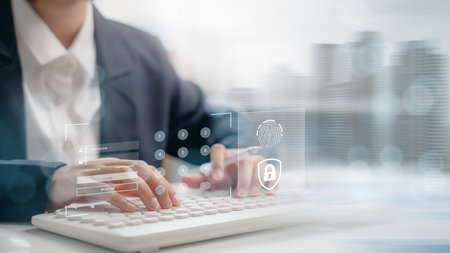 Businessman typing on virtual keyboard with digital fingerprint login interface, cybersecurity and identity authentication concept.の写真素材