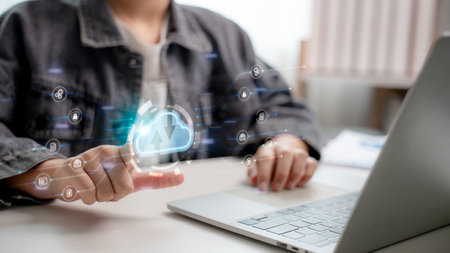 Cloud computing concept with digital data flow, user accessing storage via laptop. Modern technology for data management, network security, and smart online services.の写真素材