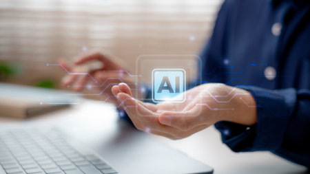 Close-up of hand holding virtual AI icon with futuristic interface. Concept of artificial intelligence assistant used in everyday life, smart tech, and digital innovation.の写真素材