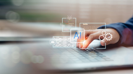Hand interacting with virtual AI assistant on laptop keyboard. Concept of artificial intelligence in data analysis, automation, machine learning, and digital transformation.の写真素材