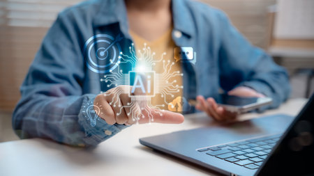 Close-up of person interacting with AI digital interface. Concept of artificial intelligence technology, smart automation, data processing, machine learning, and futuristic innovation system.の写真素材