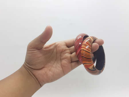 brown and red pair of bracelet on white isolation backgroundの写真素材