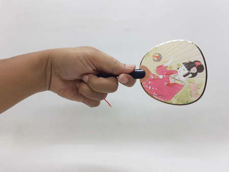 beautiful hand fan on white isolation background