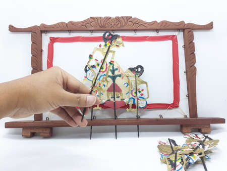 multiple wayang small leather puppet and its equipment on white isolation backgroundの写真素材