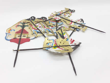 multiple wayang small leather puppet and its equipment on white isolation backgroundの写真素材