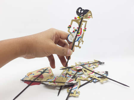 multiple wayang small leather puppet and its equipment on white isolation backgroundの写真素材