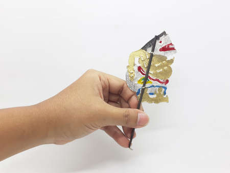 multiple wayang small leather puppet and its equipment on white isolation backgroundの写真素材