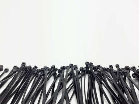 multiple black colored zip ties on white isolation background