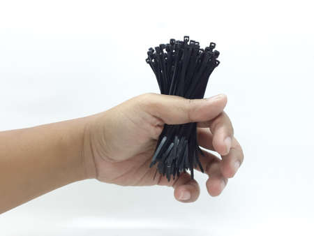 multiple black colored zip ties on white isolation background