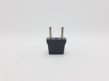 a black electrical plug adaptor on white isolation background