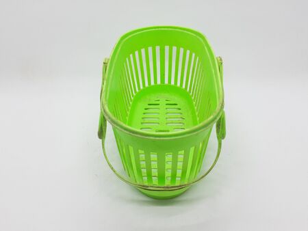 Bright Colorful Used Plastic Wicker Basket Container Package Designed for Kitchen and Bathroom Utensils in White Isolated Backgroundの写真素材