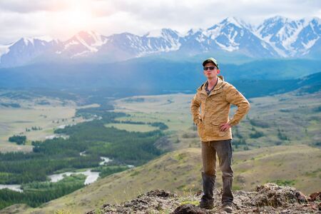 male traveler on a background of mountainの写真素材