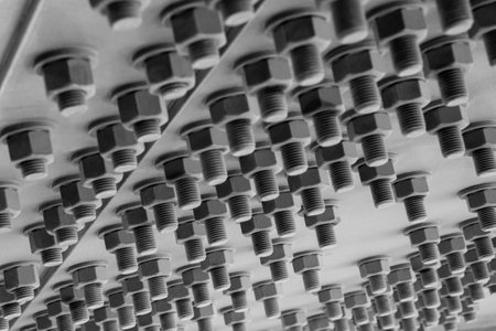 steel nuts and steel bolts grey patternの写真素材