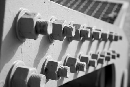 steel nuts and steel bolts grey patternの写真素材