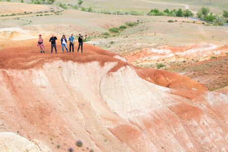 group of people taking pictures of Red Mountain