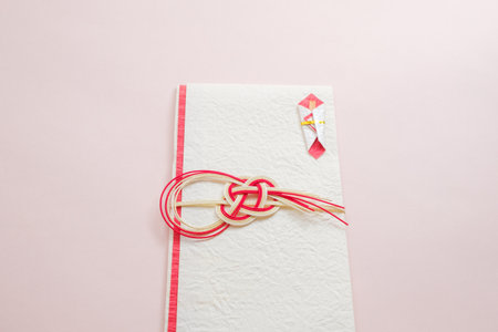Valentine's day greeting card with red ribbon on pink backgroundの写真素材