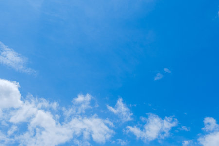 Blue sky background with tiny clouds. Natural sky background. Blue sky with tiny clouds.の写真素材
