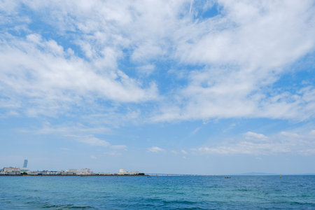 View of the sea and blue sky with white clouds in summer dayの写真素材